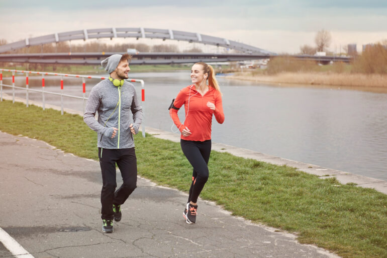 man and a lady out running