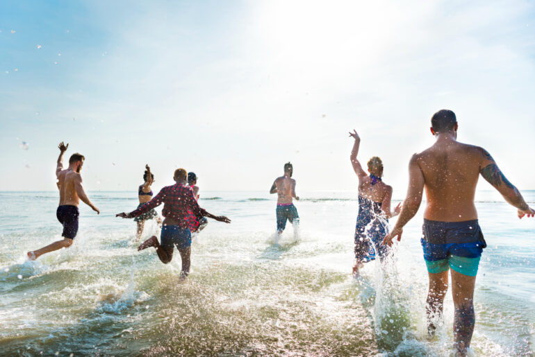 people swimming at beach